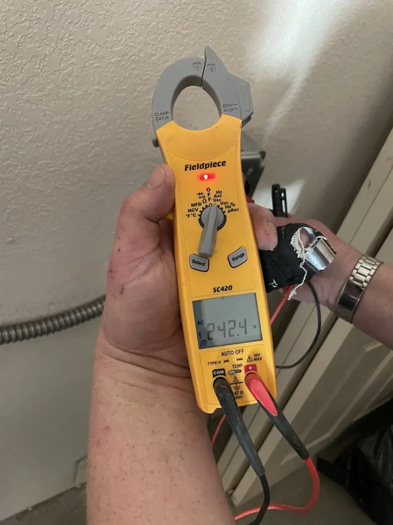 Voltage testing with clamp meter during Hot Tub / Pool Electrical Wiring in Green